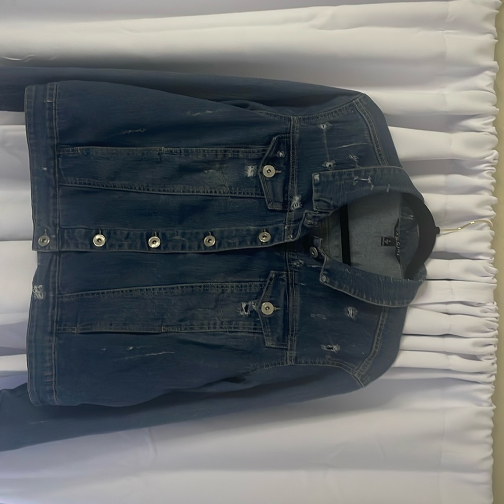 Distressed stretchy denim jacket.